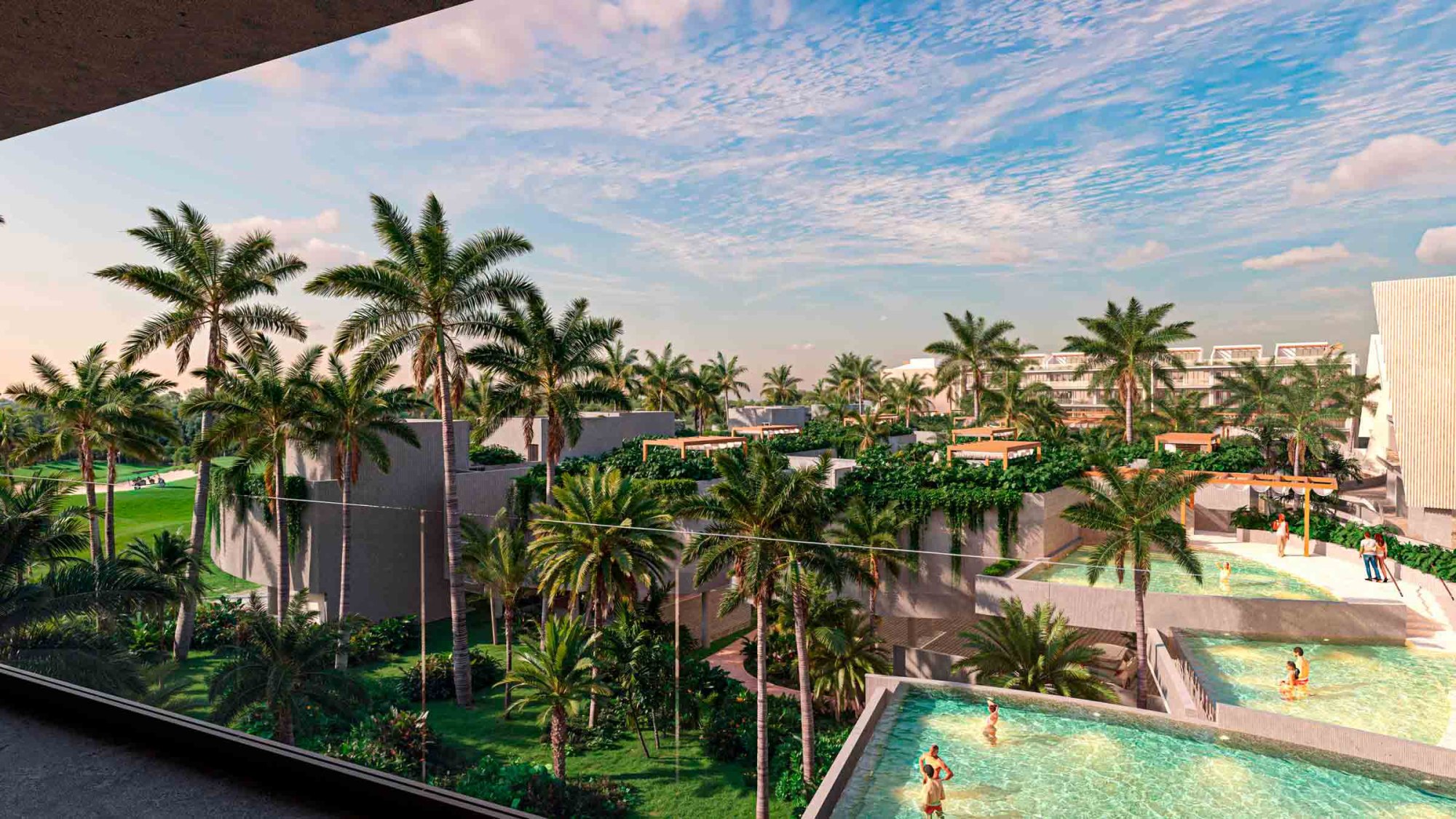 Rendering of the view at dusk from a residence terrace at Andara Cap Cana, looking over planted townhome roofs to the pools, 7 of which are planned on site.